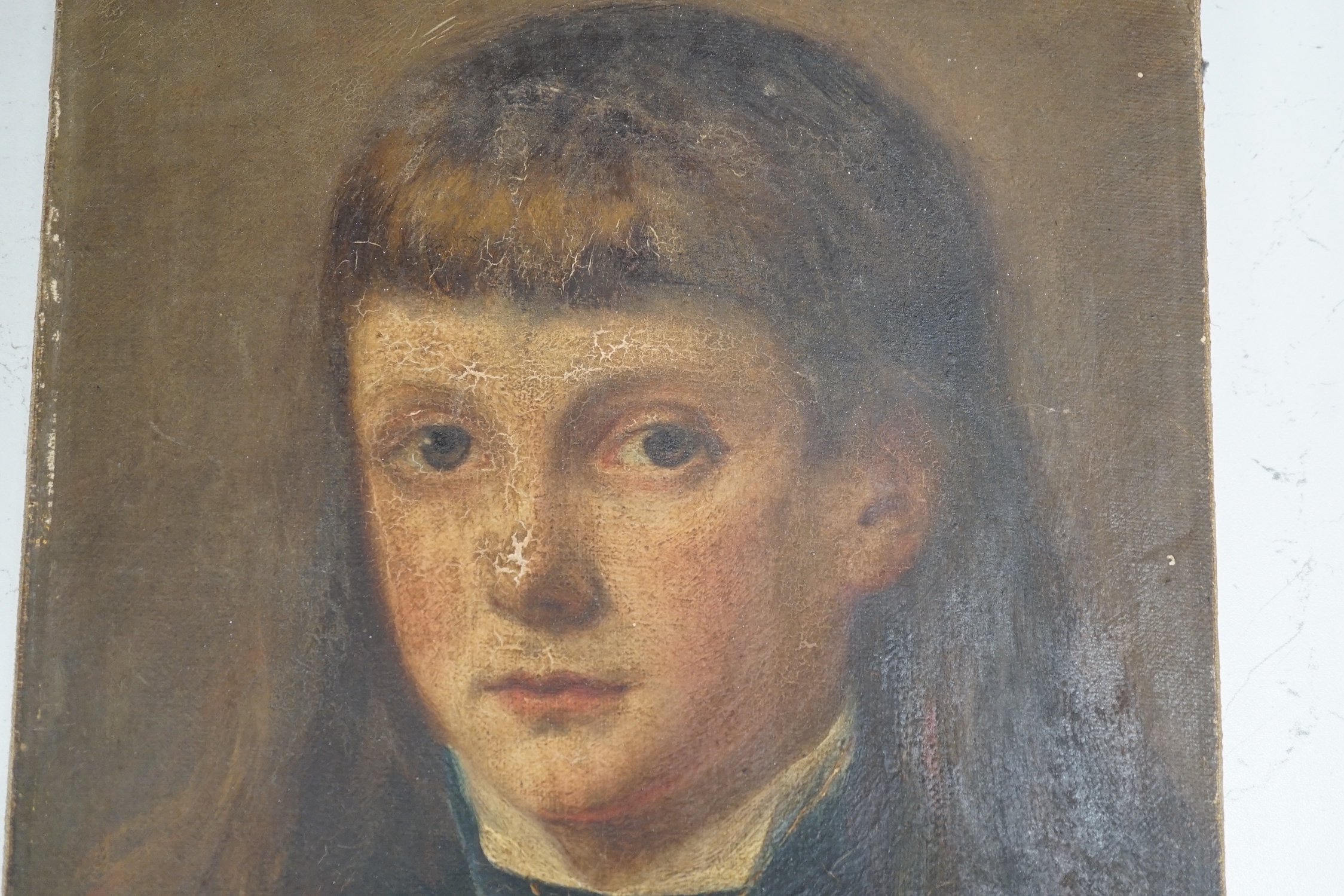 19th century English school, oil on canvas, Portrait of a youth wearing a crucifix, 34 x 27cm, unframed
